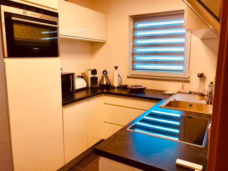 Kitchen units with oven, microwave, coffee machine, kettle and toaster